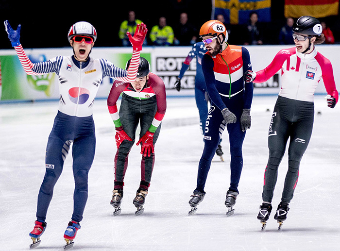 Sin Da-woon of South Korea (L) celebrates his victory in the men's 1,500 meters at the International Skating Union (ISU) World Short Track Championships in Rotterdam, the Netherlands.